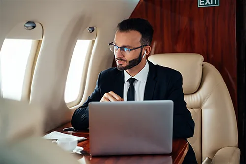 Business man flying on private jet